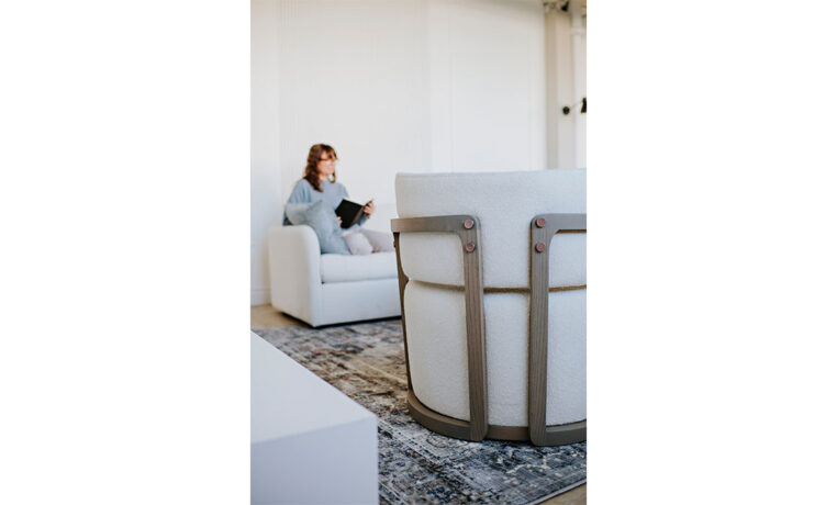 a back view detailed shot of a custom white swivel chair