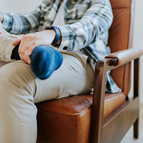 detail shot of exposed wood frame on recliner